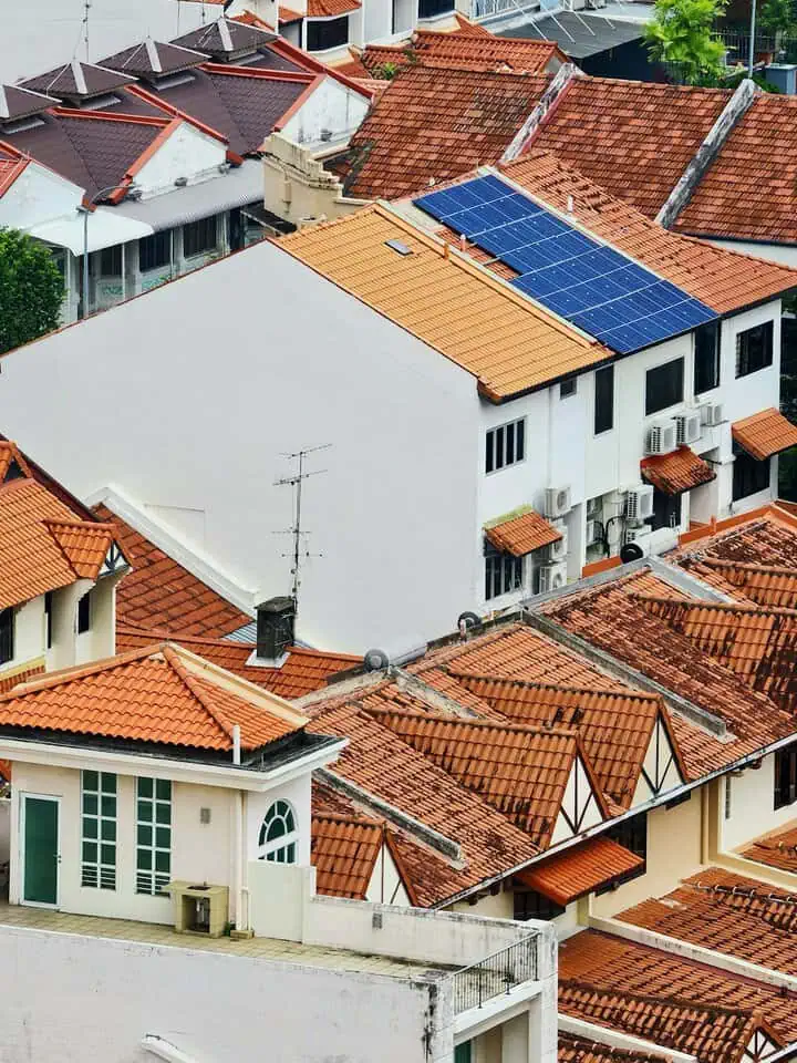 solar panels on a roof of a house which is on a hill 1